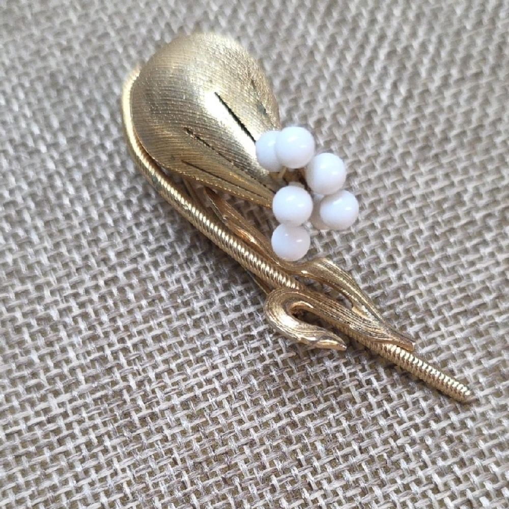 Elegant Gold and White Floral Brooch